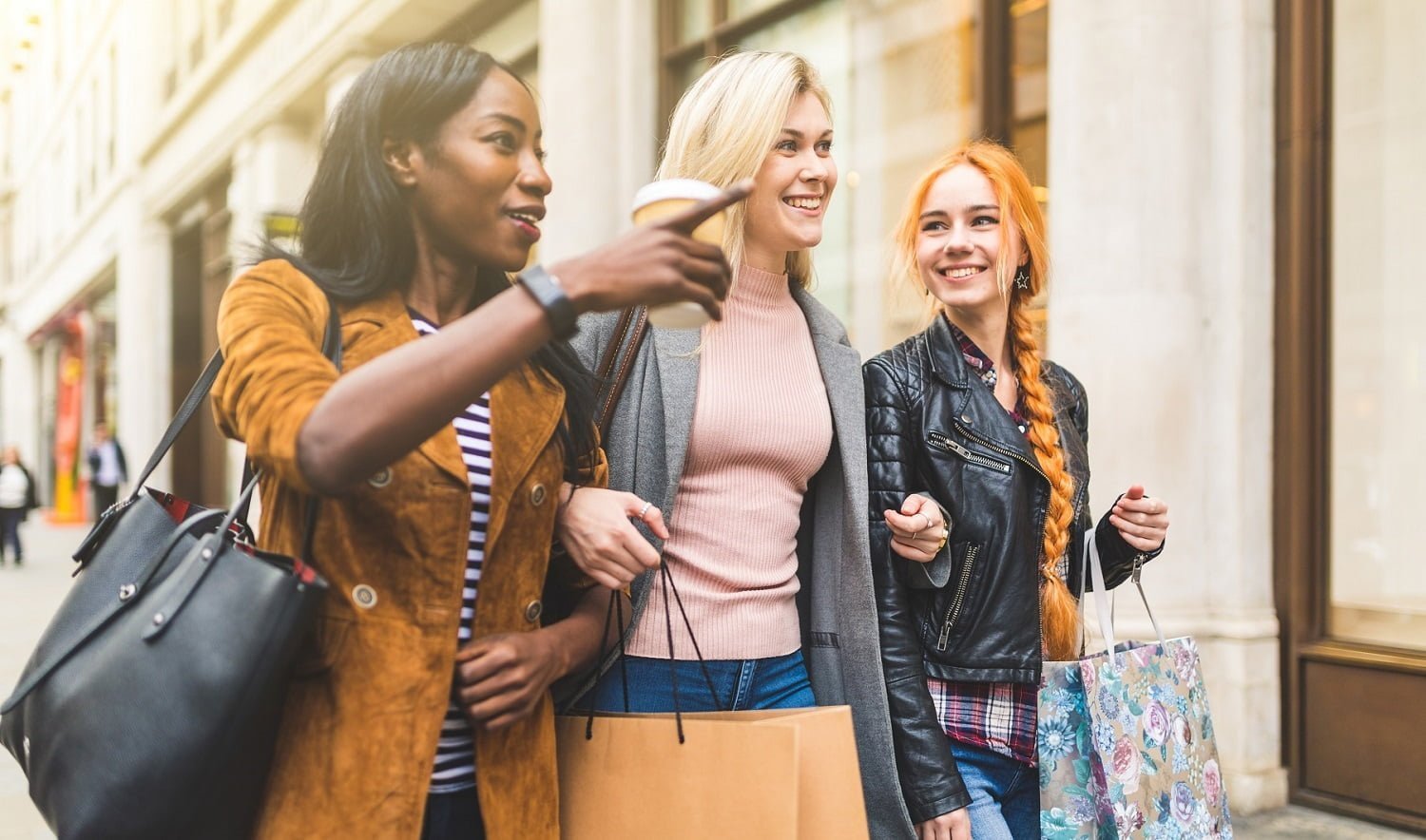 Multiracial group of women shopping and walking in the city